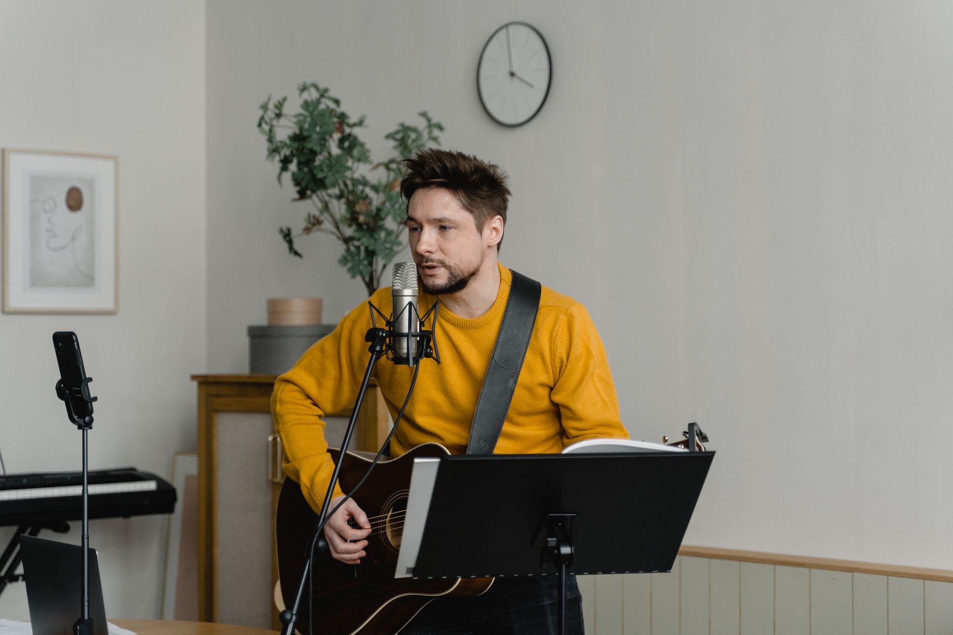 condenser microphone recording acoustic guitar close-up