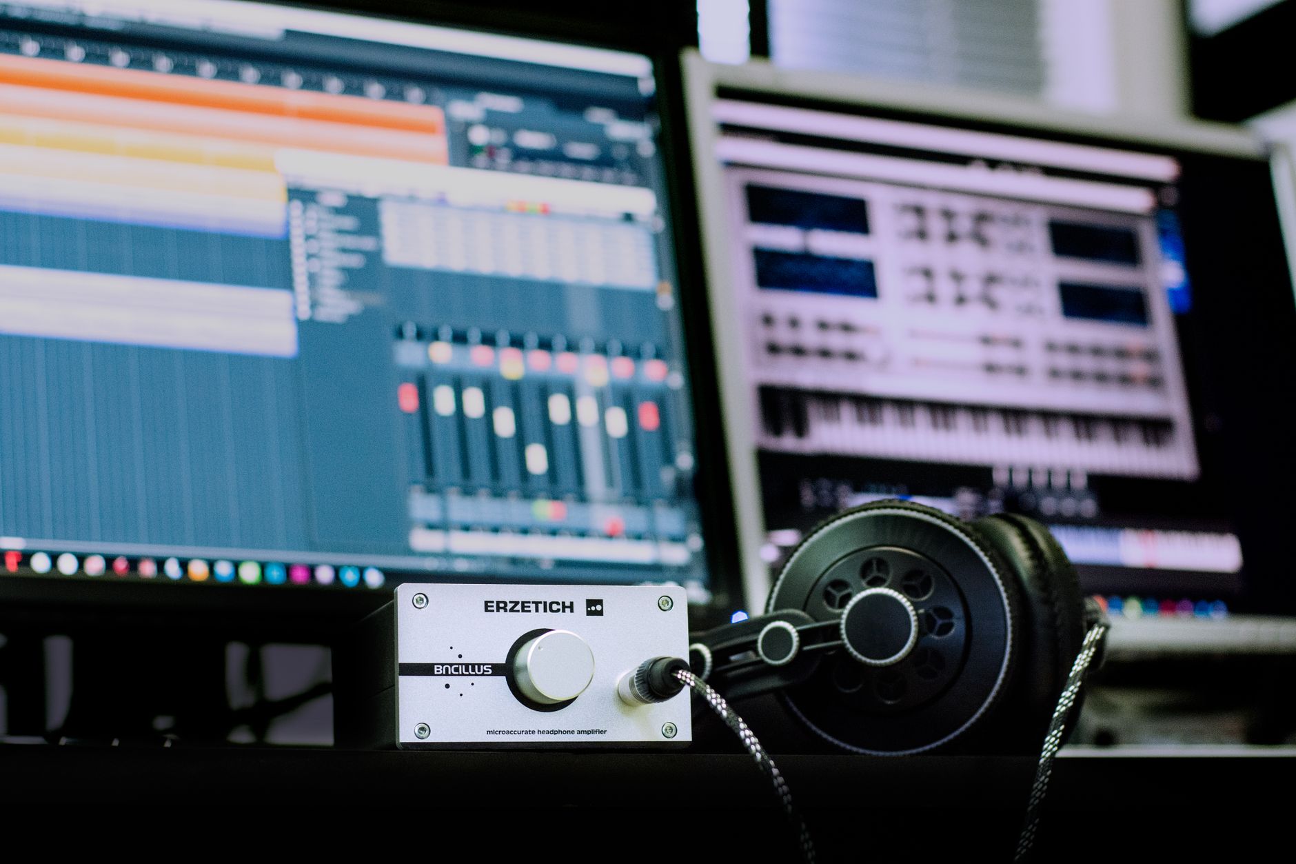 studio headphones on desk beside audio interface