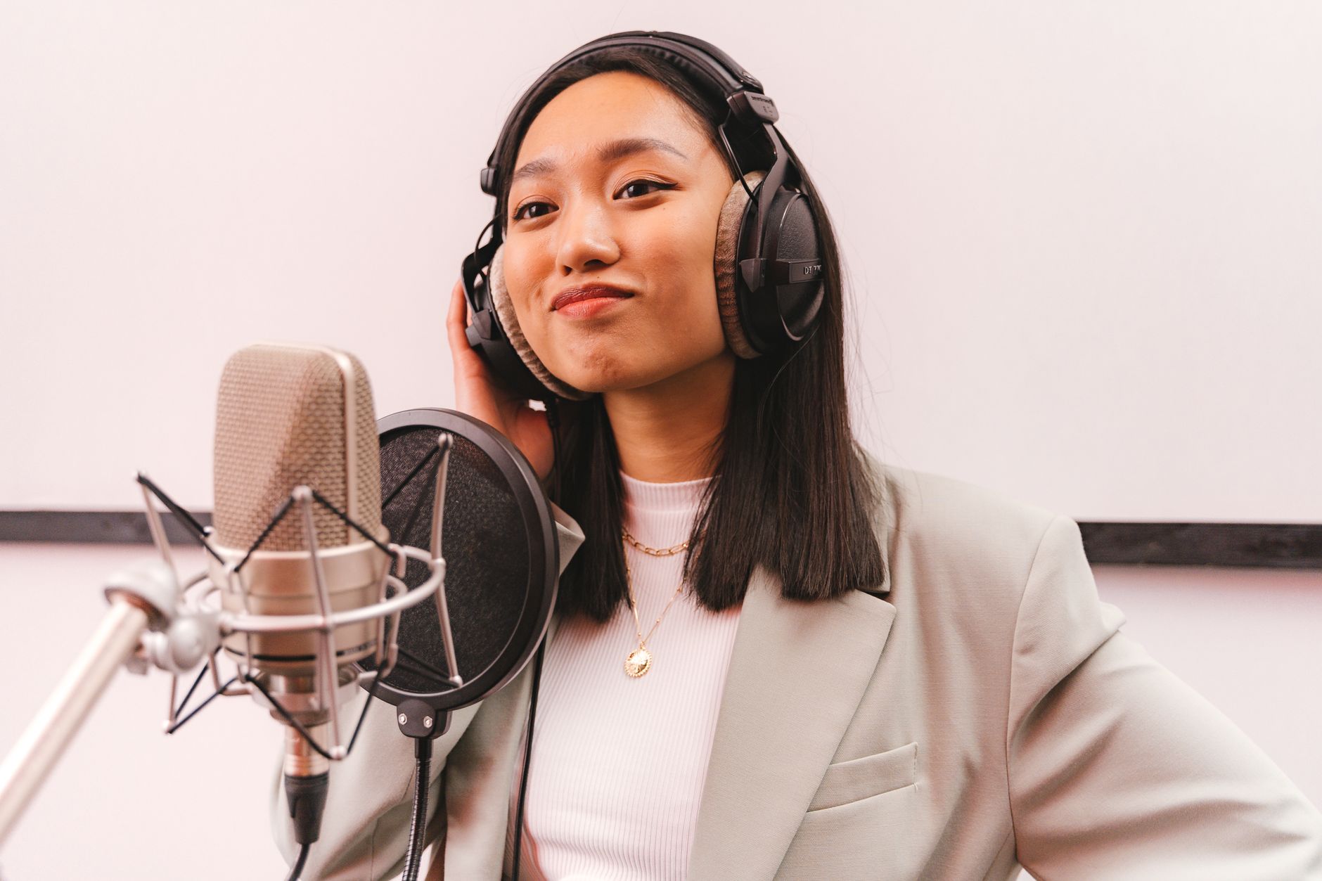 small-diaphragm condenser microphone on boom stand