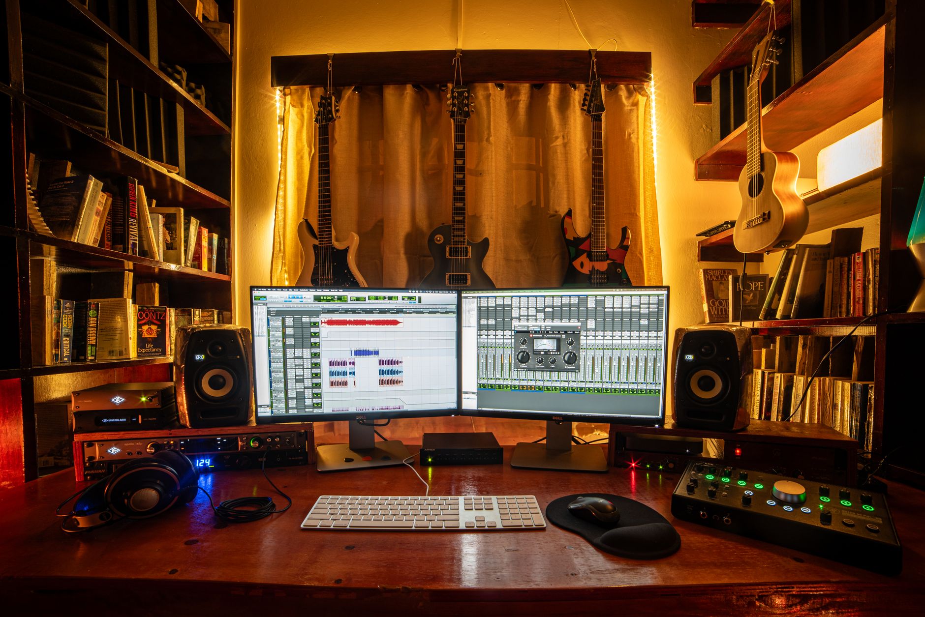 home recording studio desk setup with audio interface and monitors
