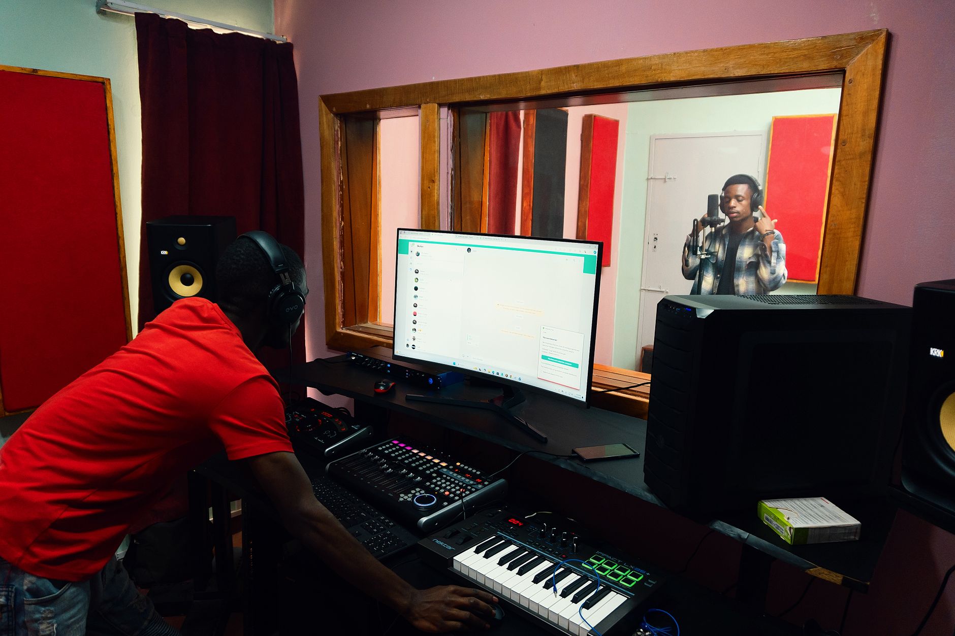 yamaha hs5 studio monitors on acoustic foam pads on desk