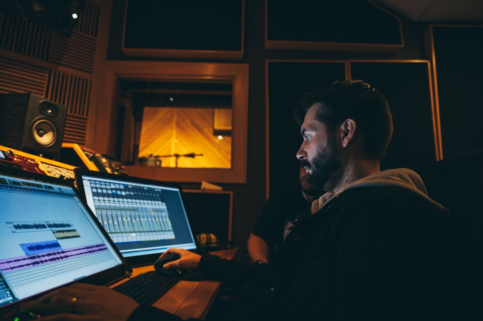 acoustic foam panels on studio wall with studio monitors