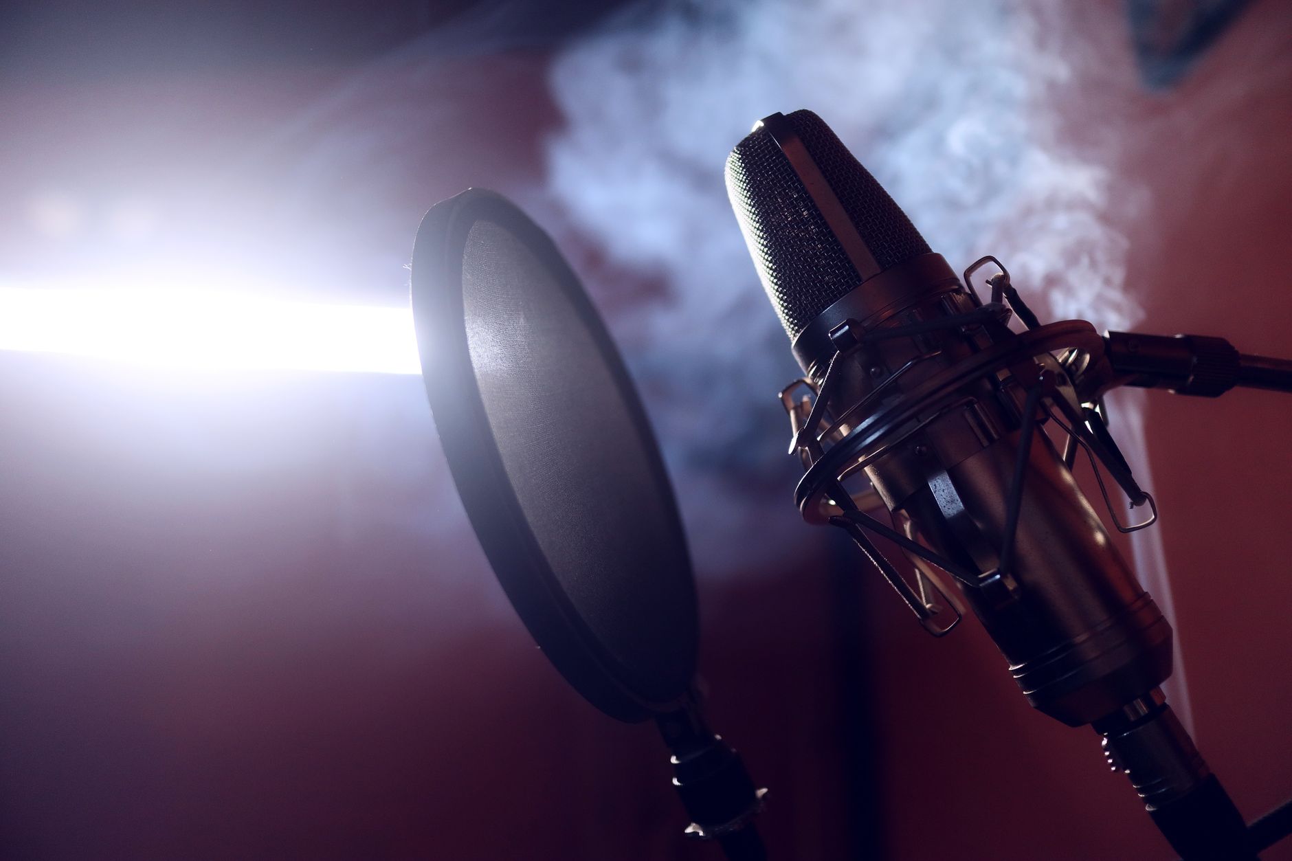 condenser microphone with pop filter on desk stand
