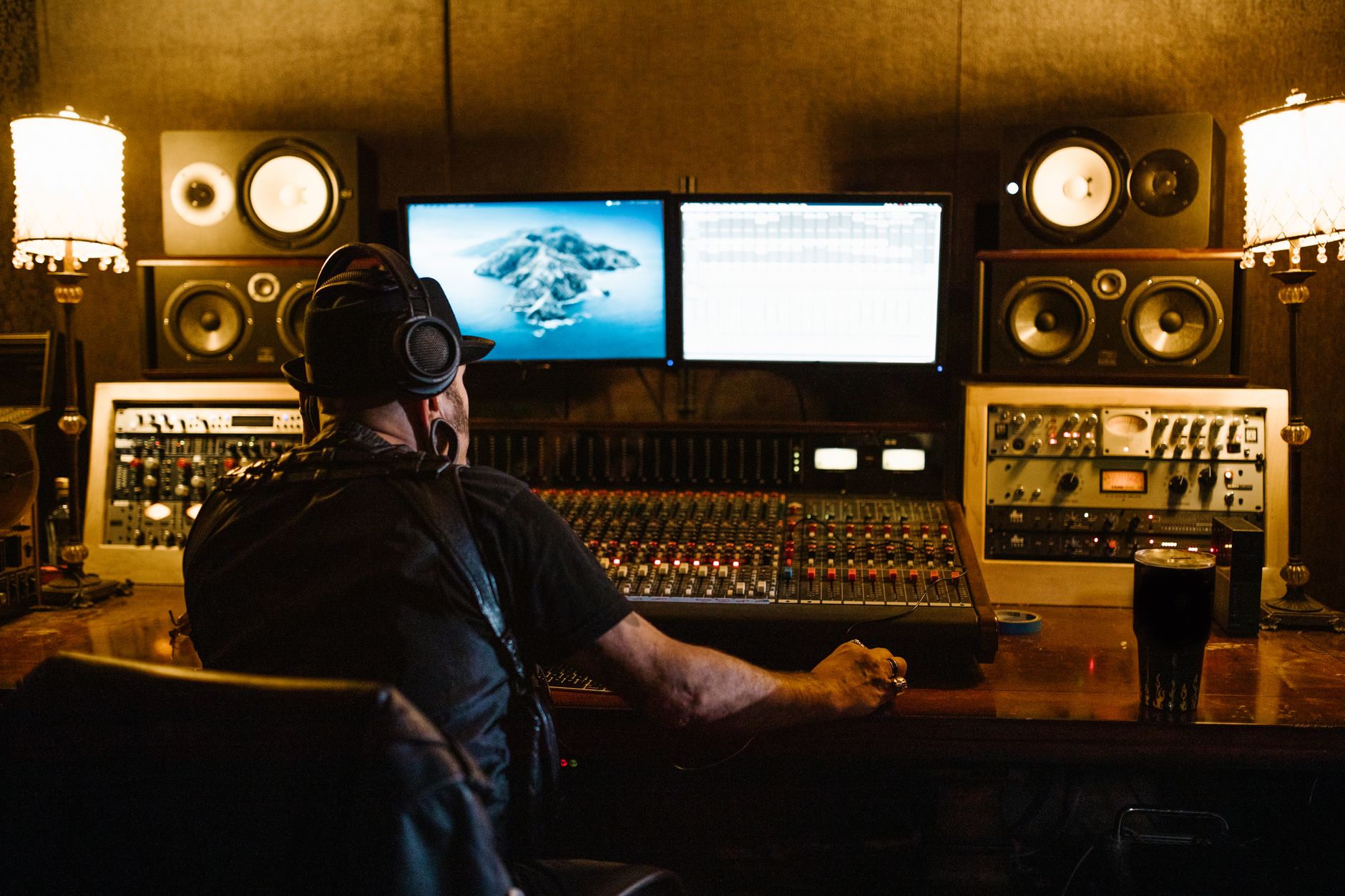 closed-back studio headphones on mixing desk