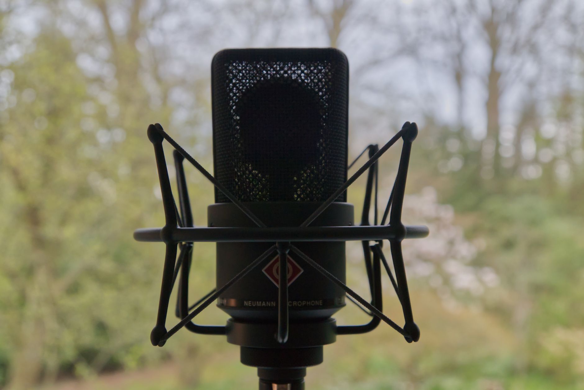 condenser microphone on desk stand pop filter