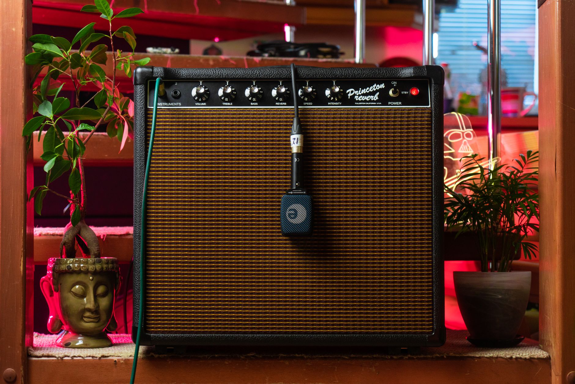 shure sm57 positioned on guitar amp grille close-up