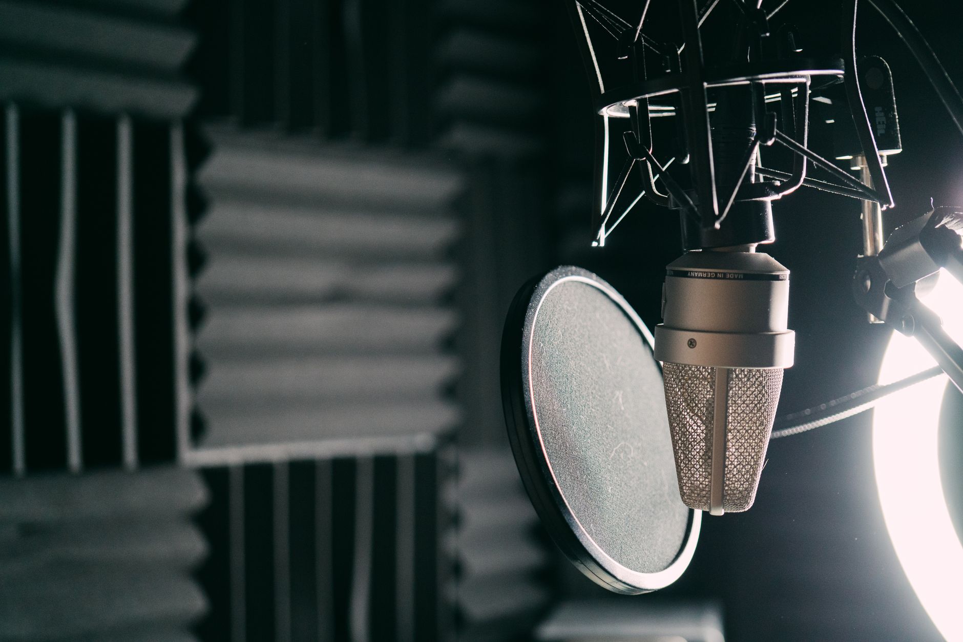 condenser microphone on stand with pop filter