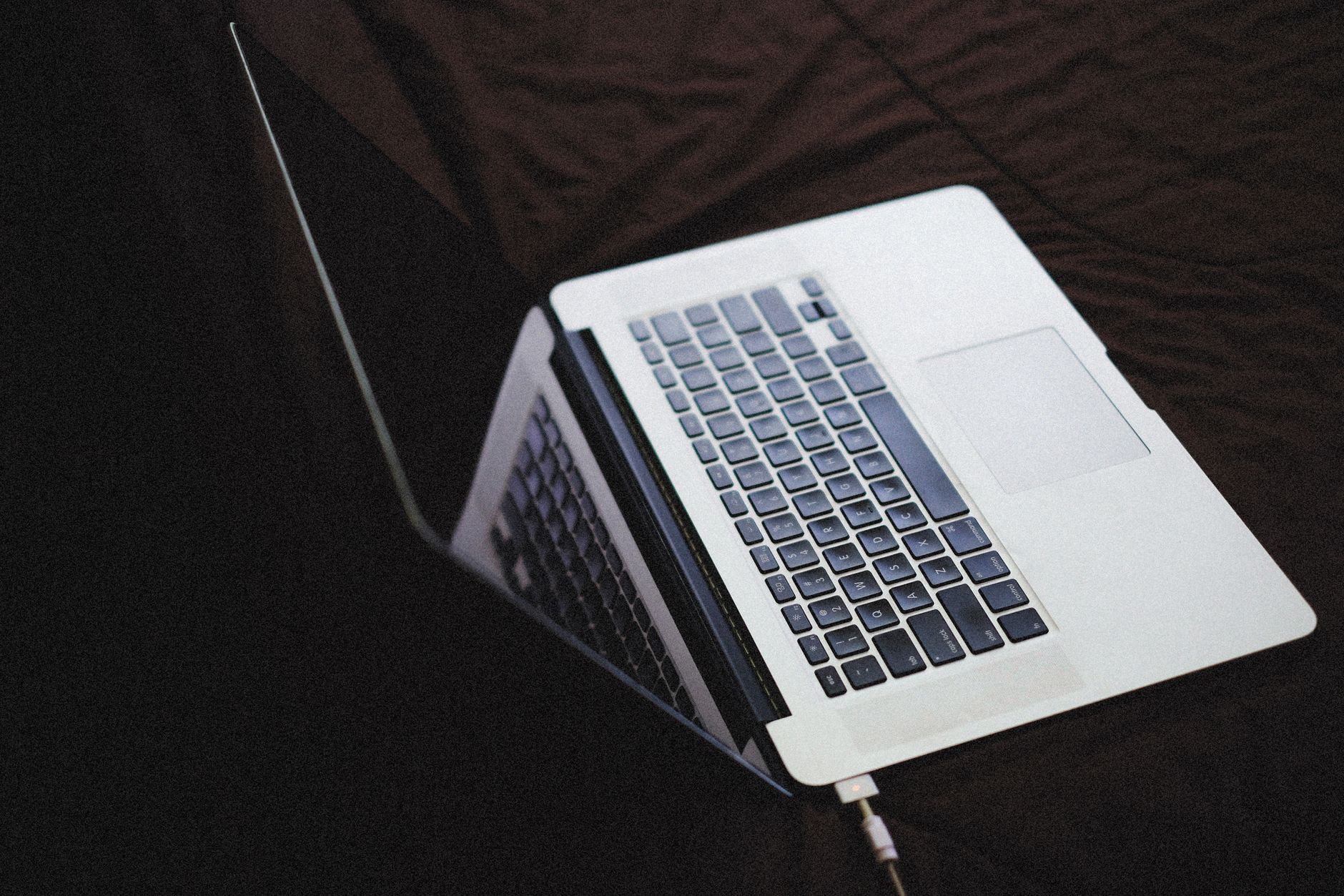midi keyboard controller connected to laptop home studio